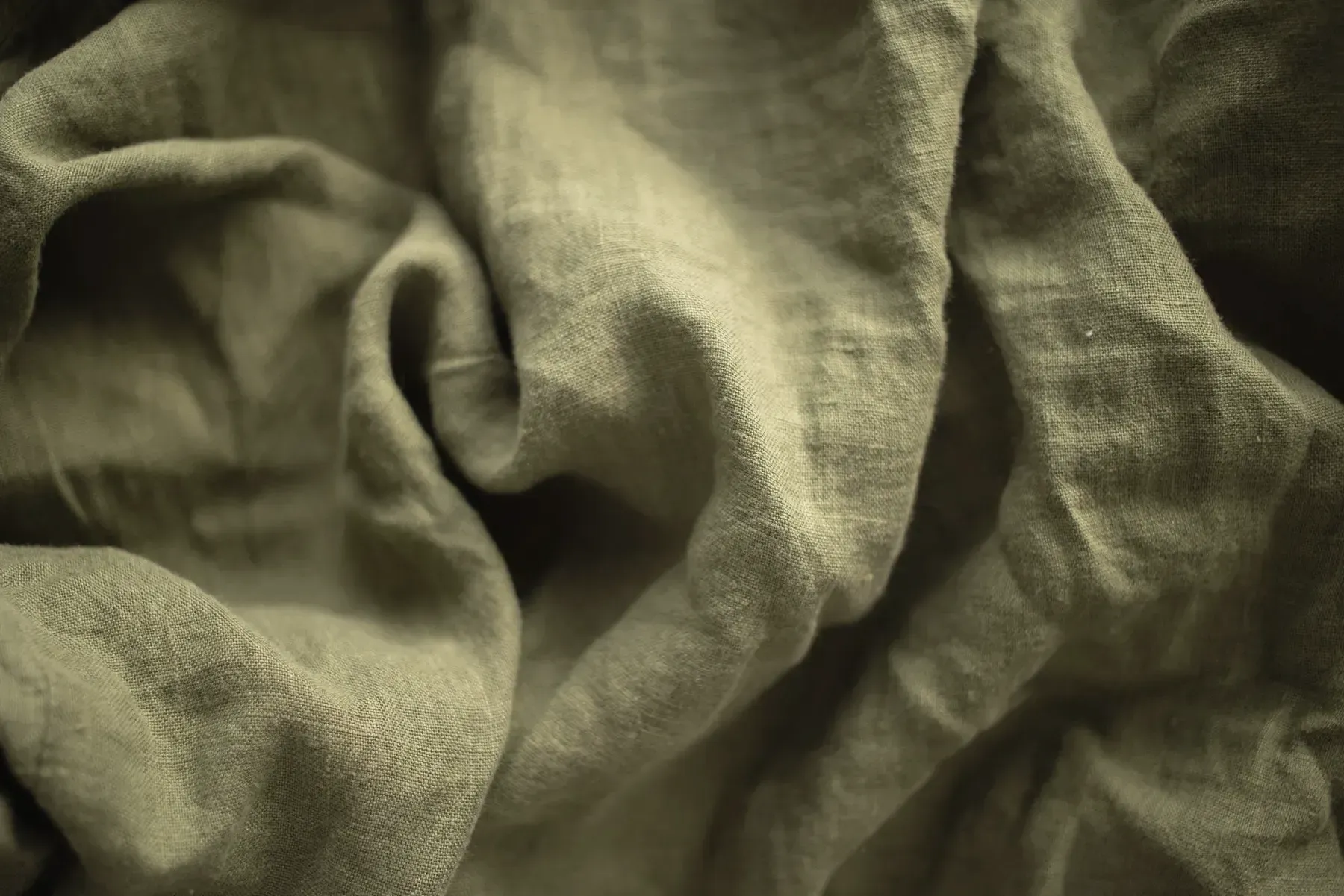 Close view of sage green crushed cotton